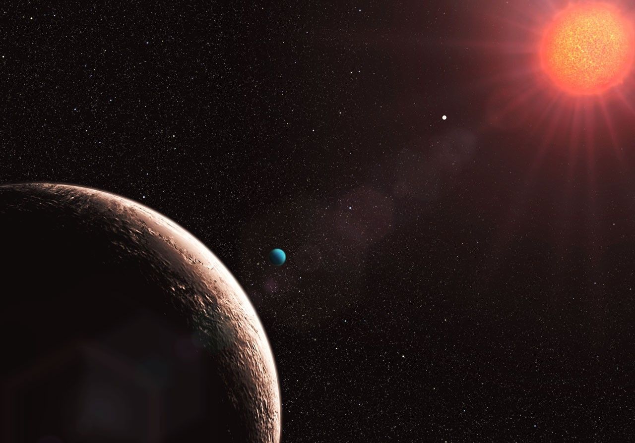 Artist concept of the Gliese 581 system with multiple planets around a red dwarf